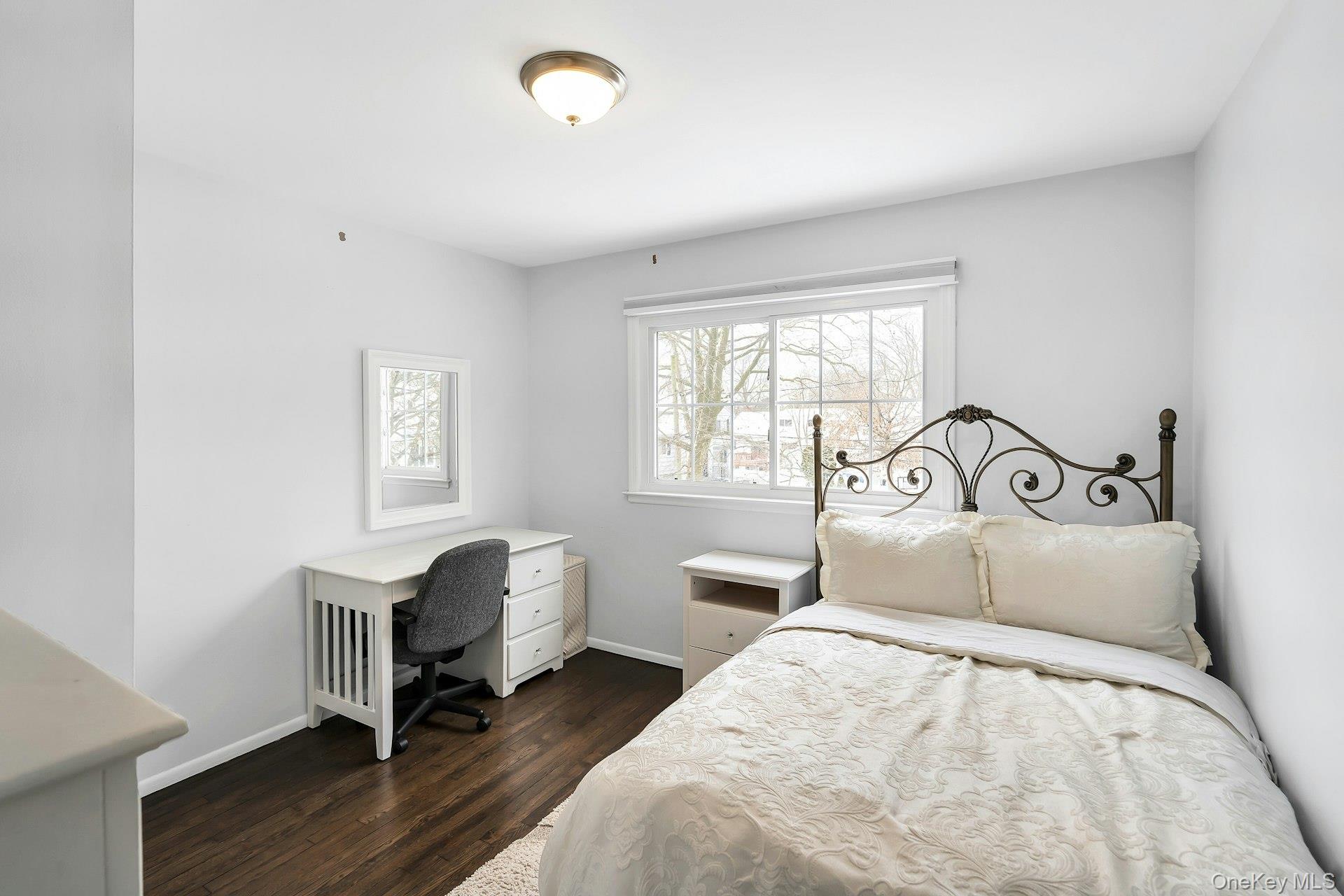 2043 Ripley Lane Merrick, NY 11566 - Photo 32 of 37 a bedroom with a bed and a window