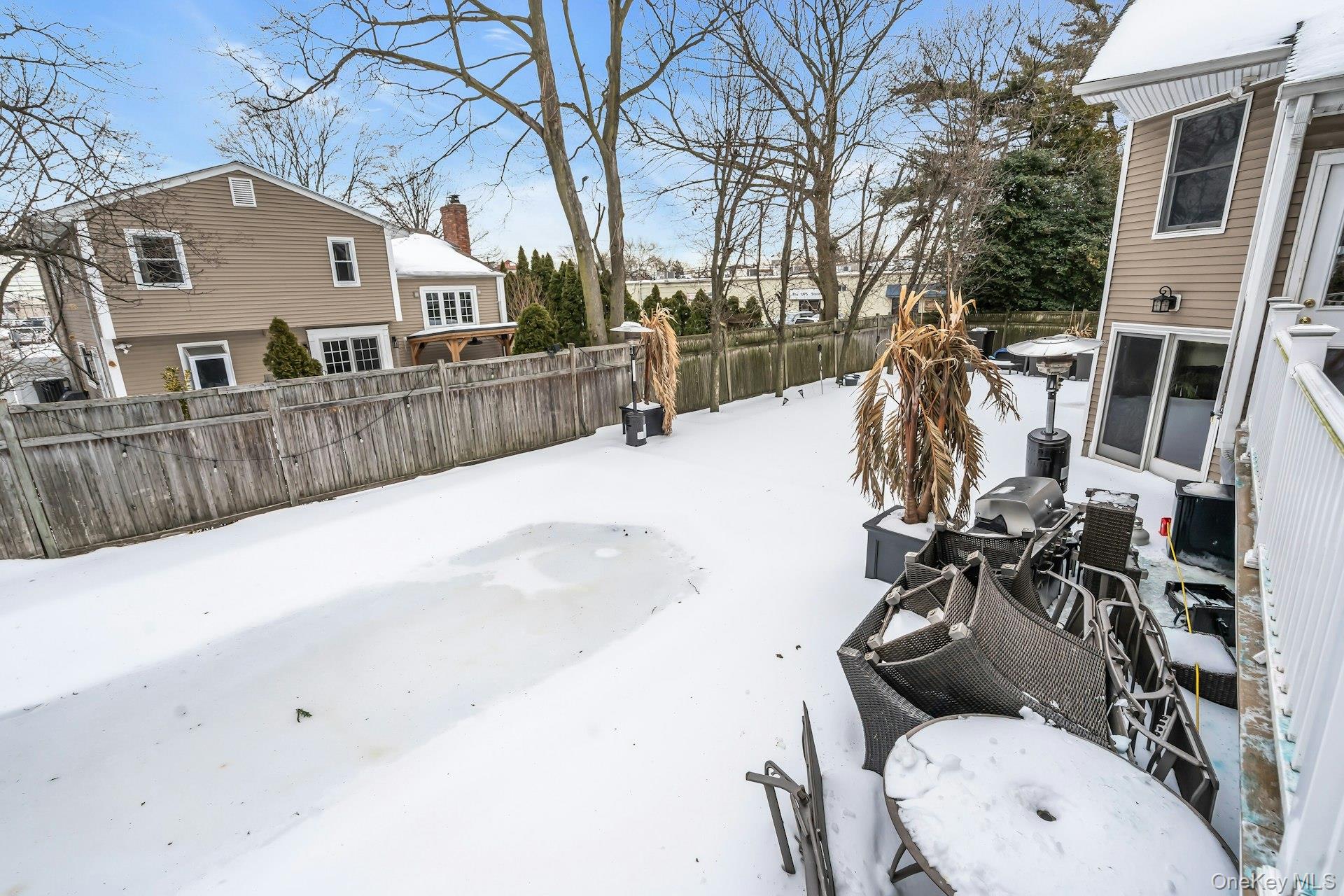2043 Ripley Lane Merrick, NY 11566 - Photo 37 of 37 a view of a house with wooden fence