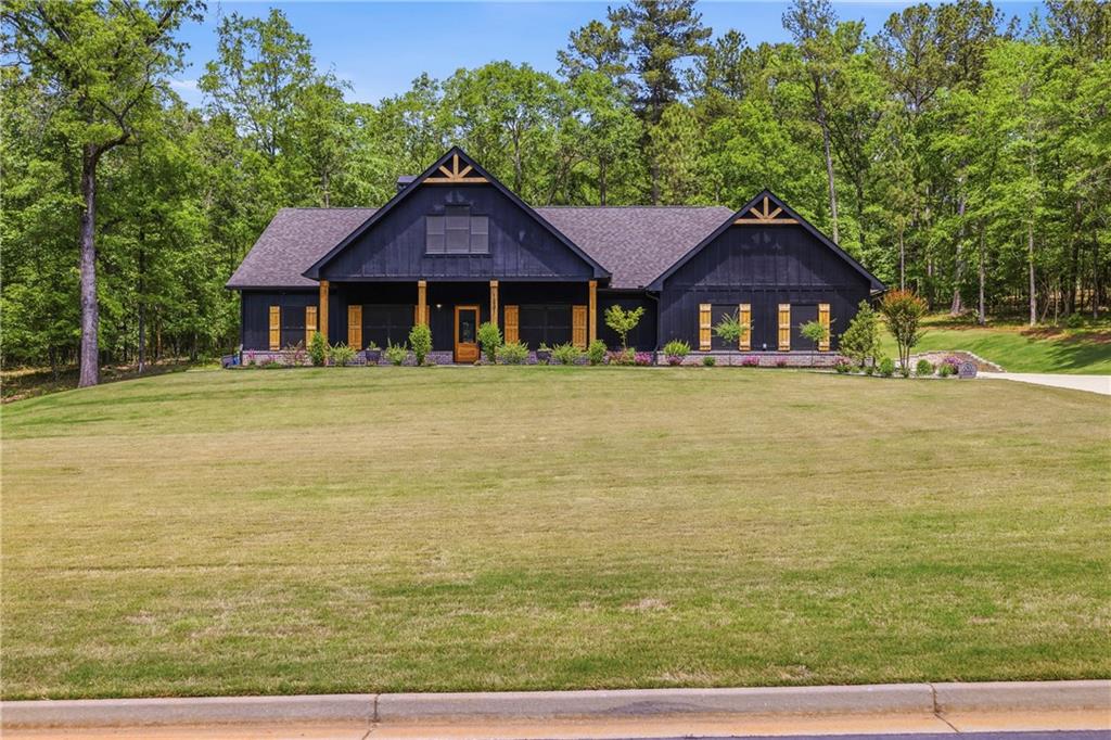 1231 Spinnaker Road Buckhead, GA 30625 - Photo 3 of 86 a front view of a house with a yard