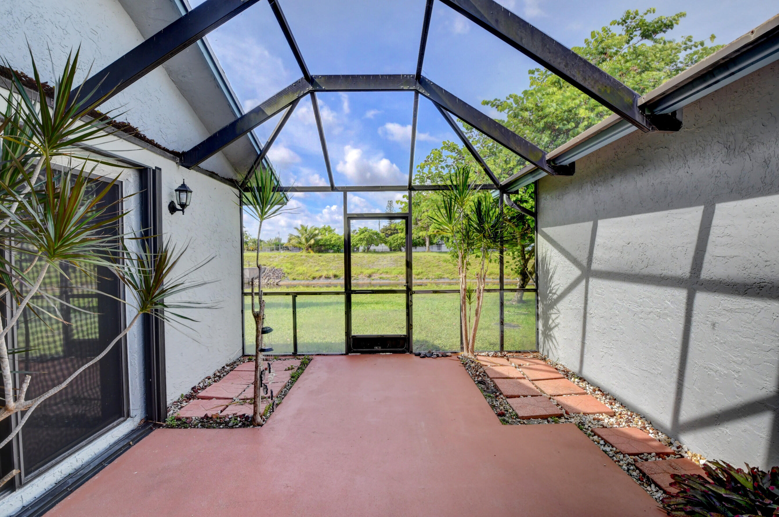 9142 Southwest 22nd Street, Unit D Boca Raton, FL 33428 - Photo 23 of 36 a garden view