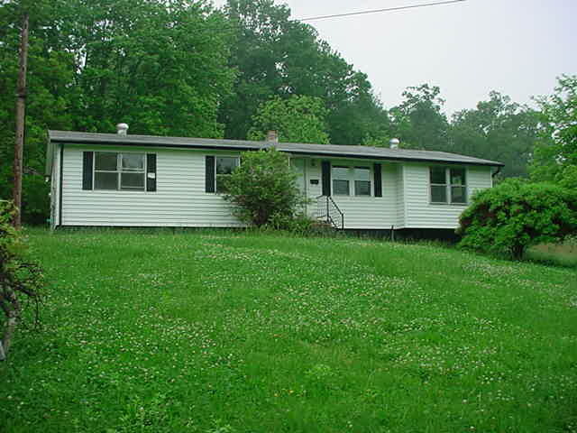 1446 Hopkins Road Rocky Mount, VA 24151 - Photo 1 of 9 a view of a house with yard and a garden