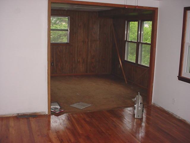 1446 Hopkins Road Rocky Mount, VA 24151 - Photo 4 of 9 an empty room with wooden floor and windows