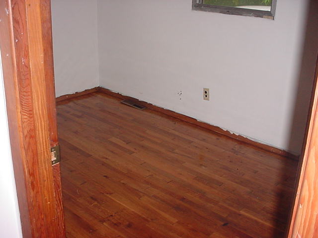 1446 Hopkins Road Rocky Mount, VA 24151 - Photo 6 of 9 an empty room with wooden floor