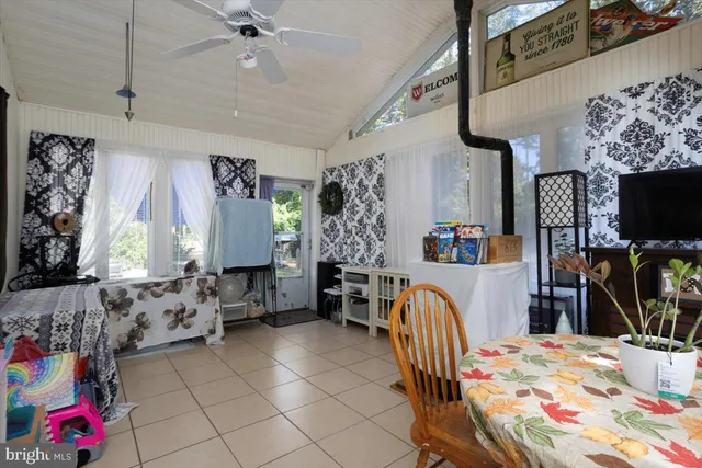 a bedroom with furniture and a flat screen tv