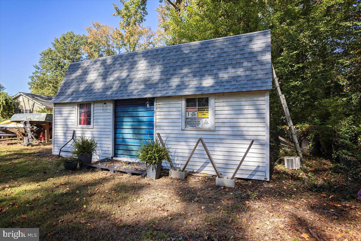 311 Kerr Avenue Denton, MD 21629 - Photo 21 of 22 a front view of a house with garden