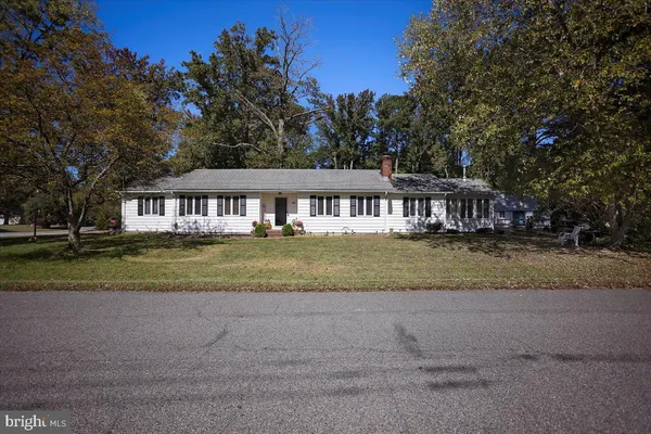 a view of house with outdoor space and lake view