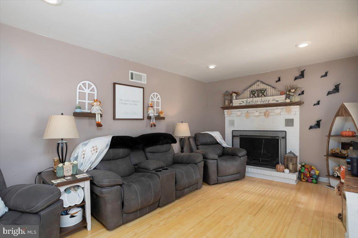 311 Kerr Avenue Denton, MD 21629 - Photo 6 of 22 a living room with furniture and a fireplace