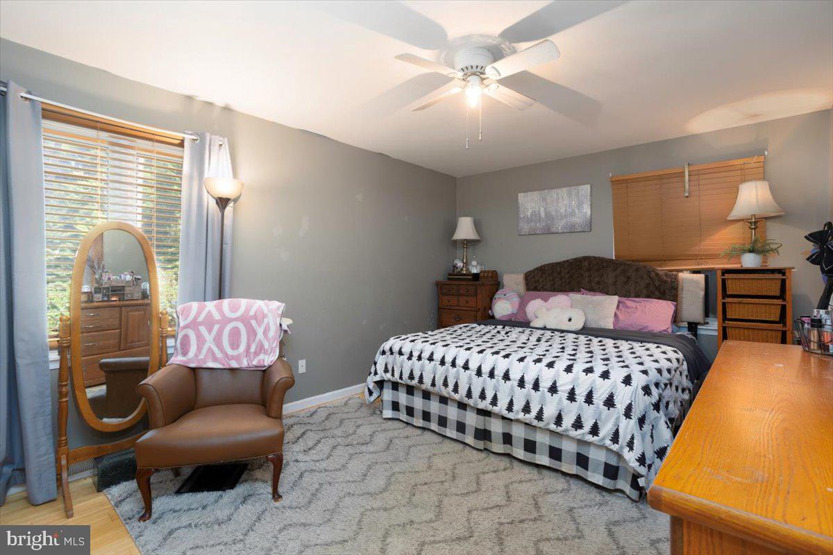 311 Kerr Avenue Denton, MD 21629 - Photo 10 of 22 a bedroom with a bed and chair