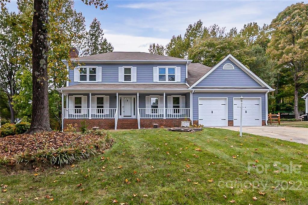 2927 Trotters Road Gastonia, NC 28054 - Photo 1 of 16 a front view of a house with a garden