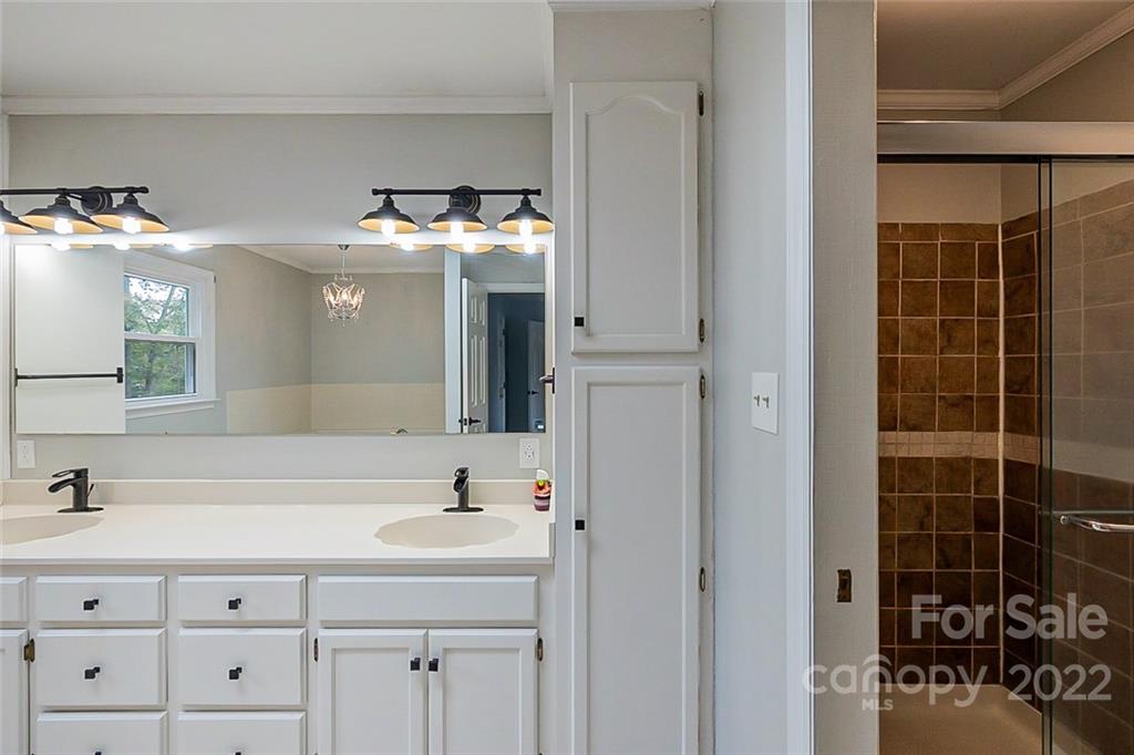 2927 Trotters Road Gastonia, NC 28054 - Photo 12 of 16 a bathroom with a sink and a mirror