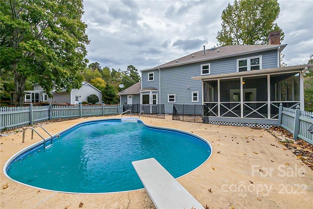 2927 Trotters Road Gastonia, NC 28054 - Photo 15 of 16 a view of a house with swimming pool and porch