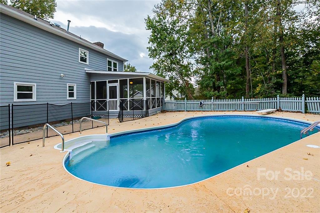 2927 Trotters Road Gastonia, NC 28054 - Photo 16 of 16 a view of a swimming pool with a lounge chair