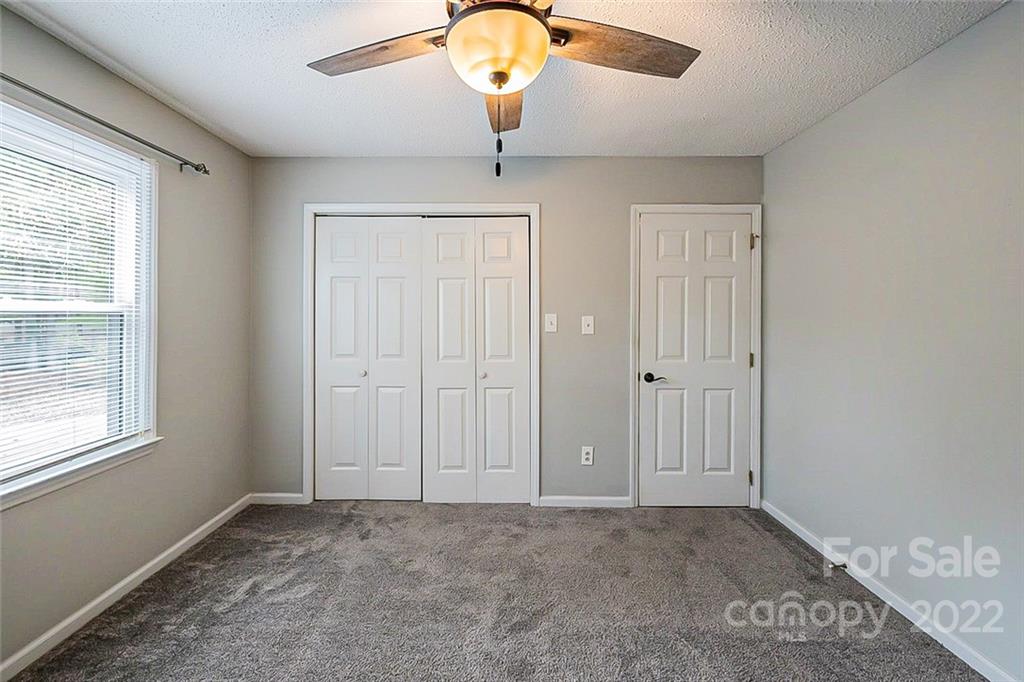 2927 Trotters Road Gastonia, NC 28054 - Photo 8 of 16 wooden floor in an empty room with a window