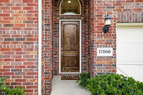 a view of a building with a door and wooden floor