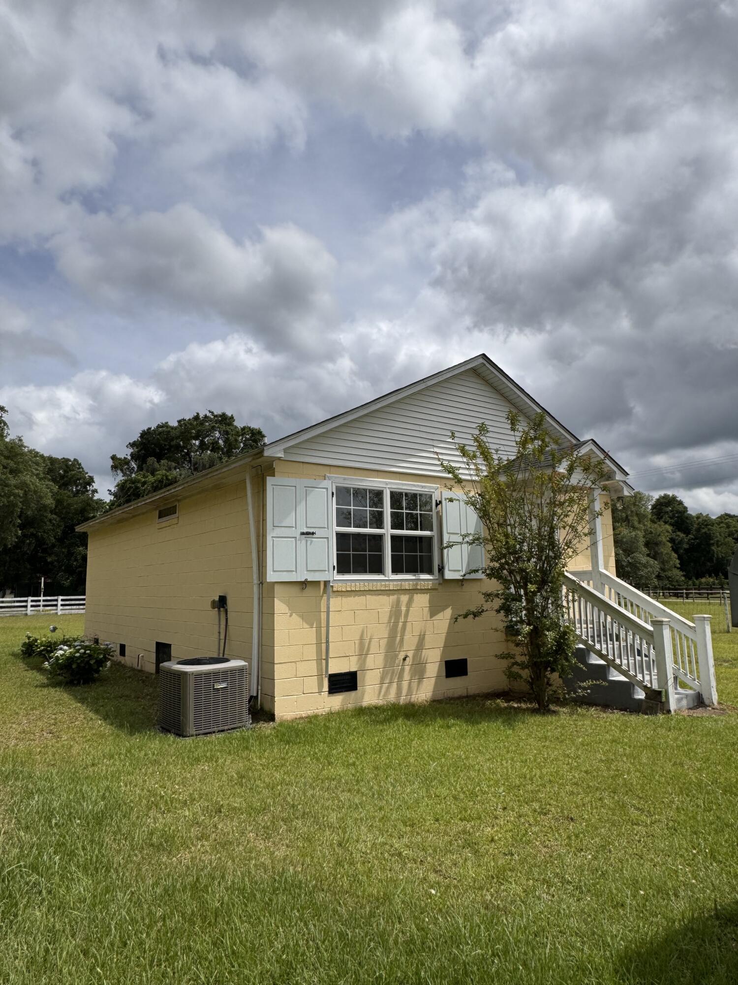 3476 Bohicket Road Johns Island, SC 29455 - Photo 23 of 35 Back of house from oaks