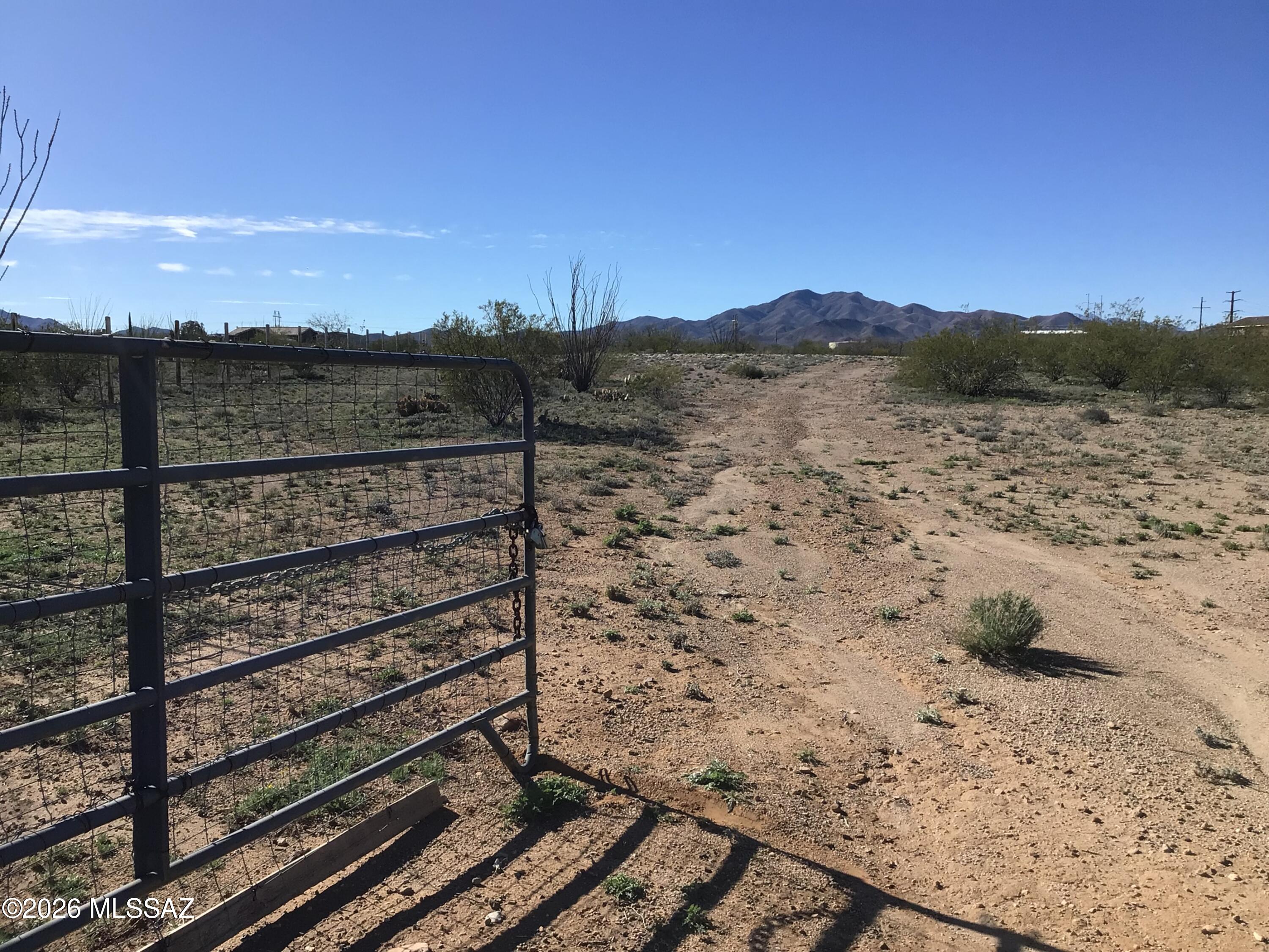 3250 East Rincon View Drive, Unit 45 Vail, AZ 85641 - Photo 1 of 6 a view of a yard with wooden fence