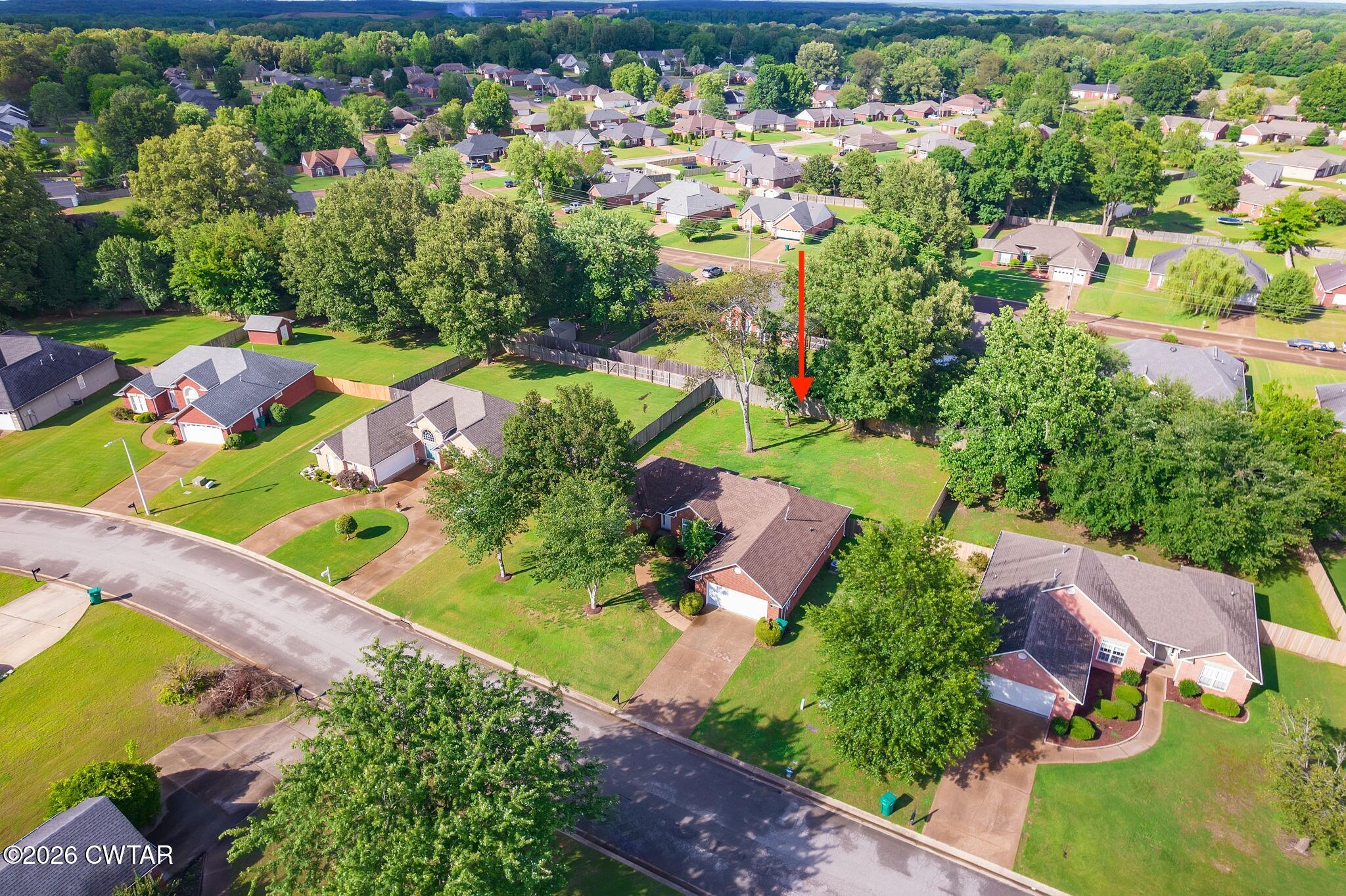 96 Sundown Drive Jackson, TN 38305 - Photo 24 of 28 an aerial view of a house with a yard