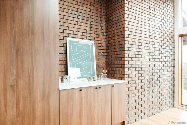 a living room with furniture potted plant and a fireplace