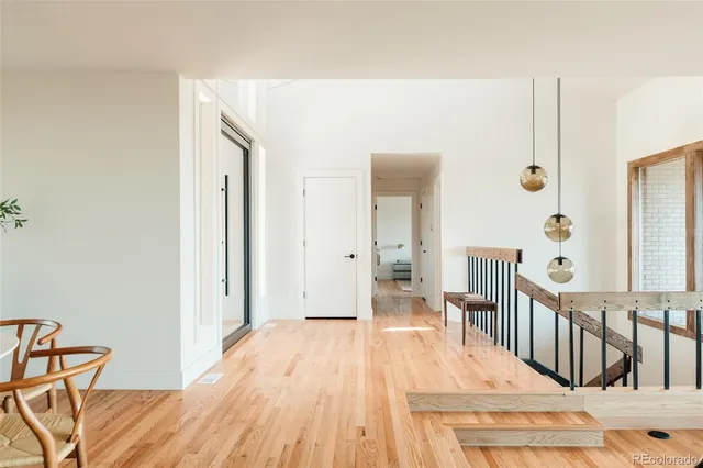a view of a balcony with wooden floor and city view