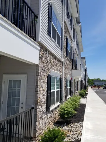 a view of outdoor space with playground and green space