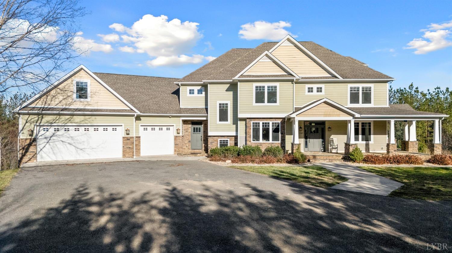 a view of a white house with a yard