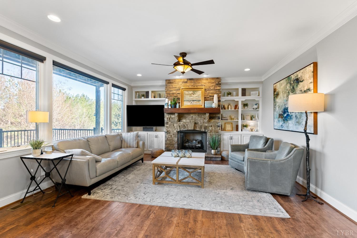1249 Lees Mill Lane Goode, VA 24556 - Photo 11 of 98 a living room with fireplace furniture and a flat screen tv