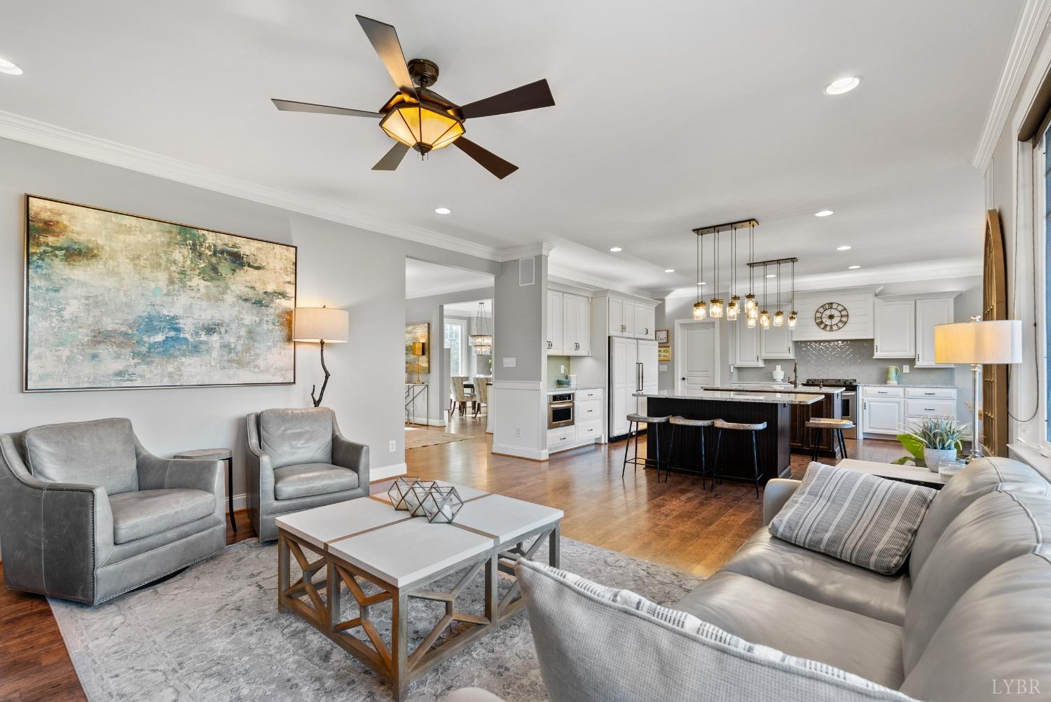 1249 Lees Mill Lane Goode, VA 24556 - Photo 14 of 98 a living room with furniture kitchen view and a chandelier
