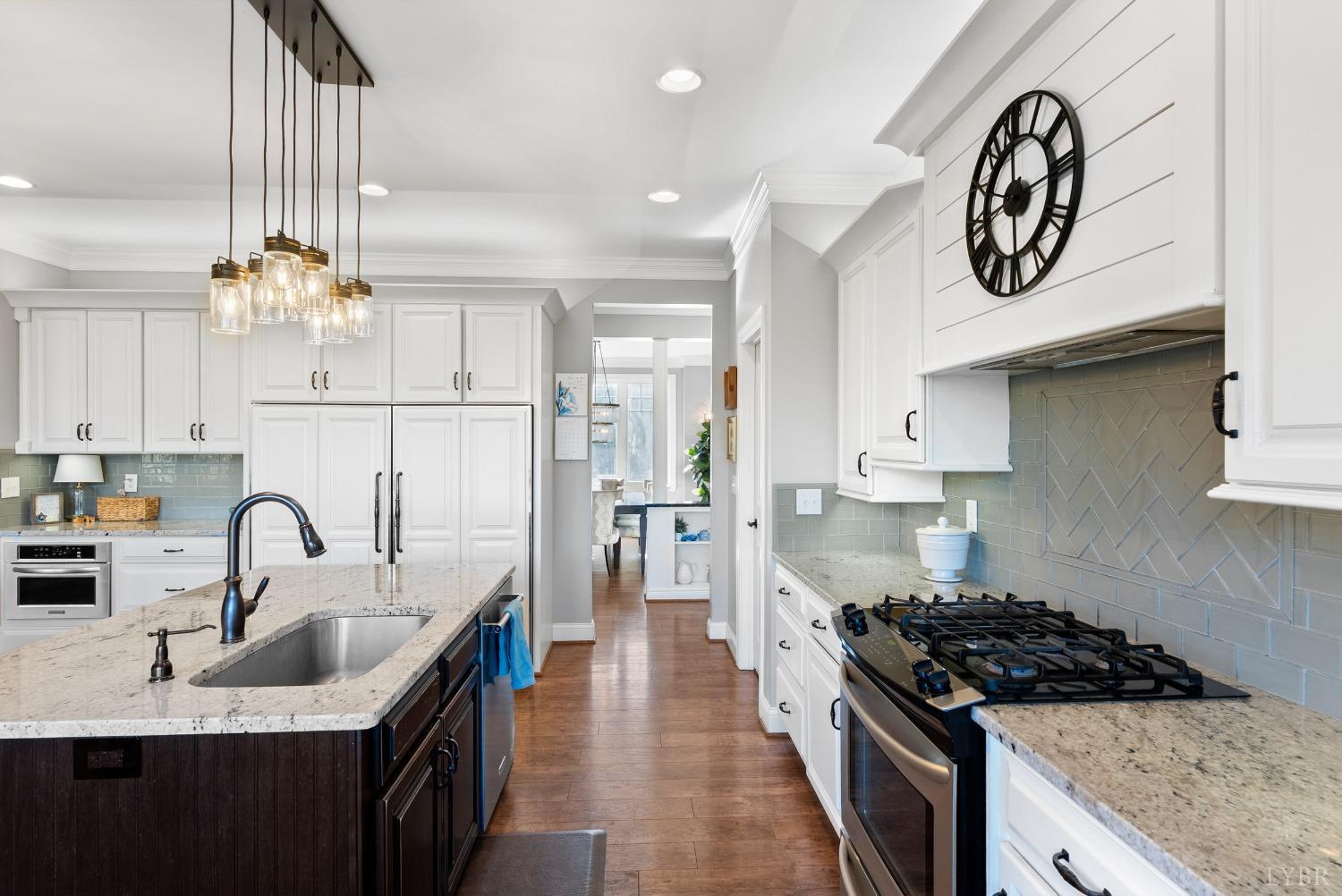 1249 Lees Mill Lane Goode, VA 24556 - Photo 18 of 98 a kitchen with stainless steel appliances granite countertop a sink stove and cabinets