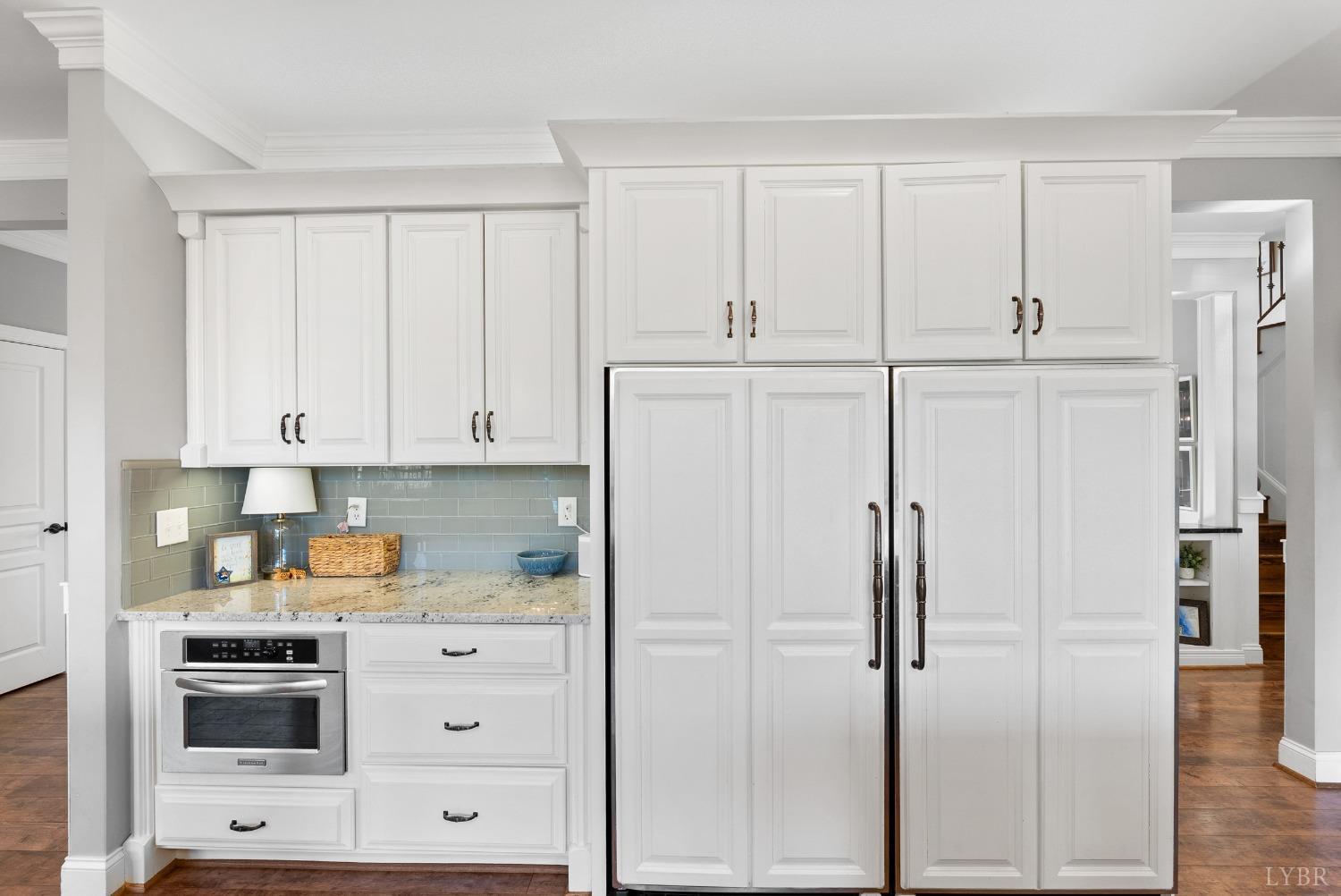 1249 Lees Mill Lane Goode, VA 24556 - Photo 19 of 98 a kitchen with white cabinets and white appliances