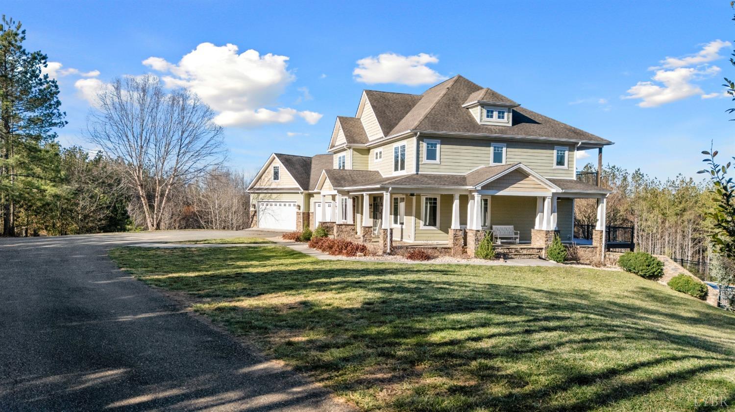 1249 Lees Mill Lane Goode, VA 24556 - Photo 2 of 98 a front view of a house with a yard