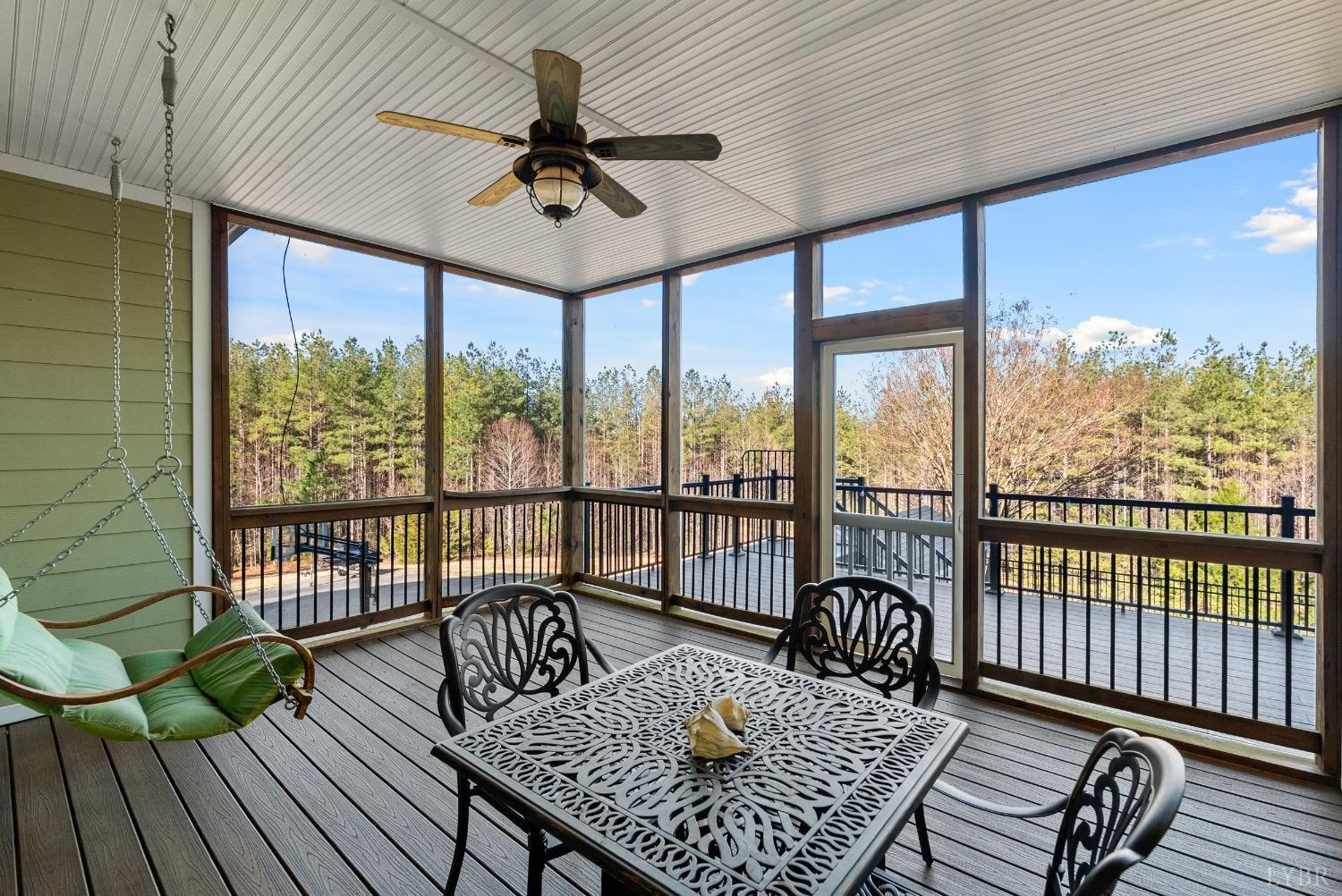 1249 Lees Mill Lane Goode, VA 24556 - Photo 24 of 98 a living room with furniture and a floor to ceiling window