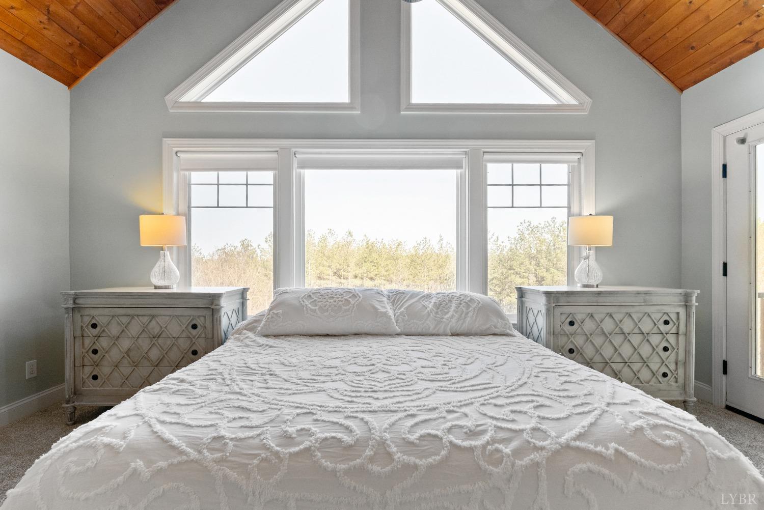 1249 Lees Mill Lane Goode, VA 24556 - Photo 46 of 98 a bedroom with a large bed and a window