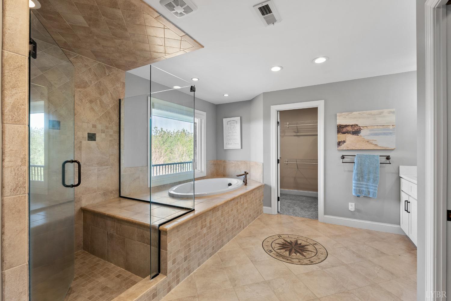 1249 Lees Mill Lane Goode, VA 24556 - Photo 49 of 98 a spacious bathroom with a tub sink and mirror