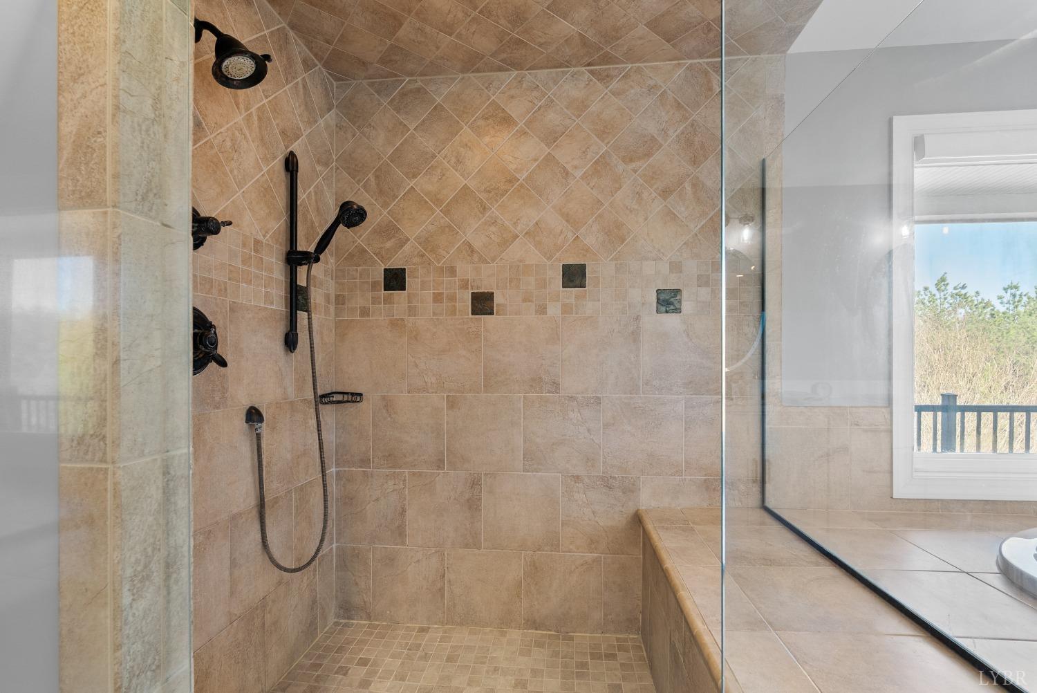 1249 Lees Mill Lane Goode, VA 24556 - Photo 51 of 98 a bathroom with a glass shower door