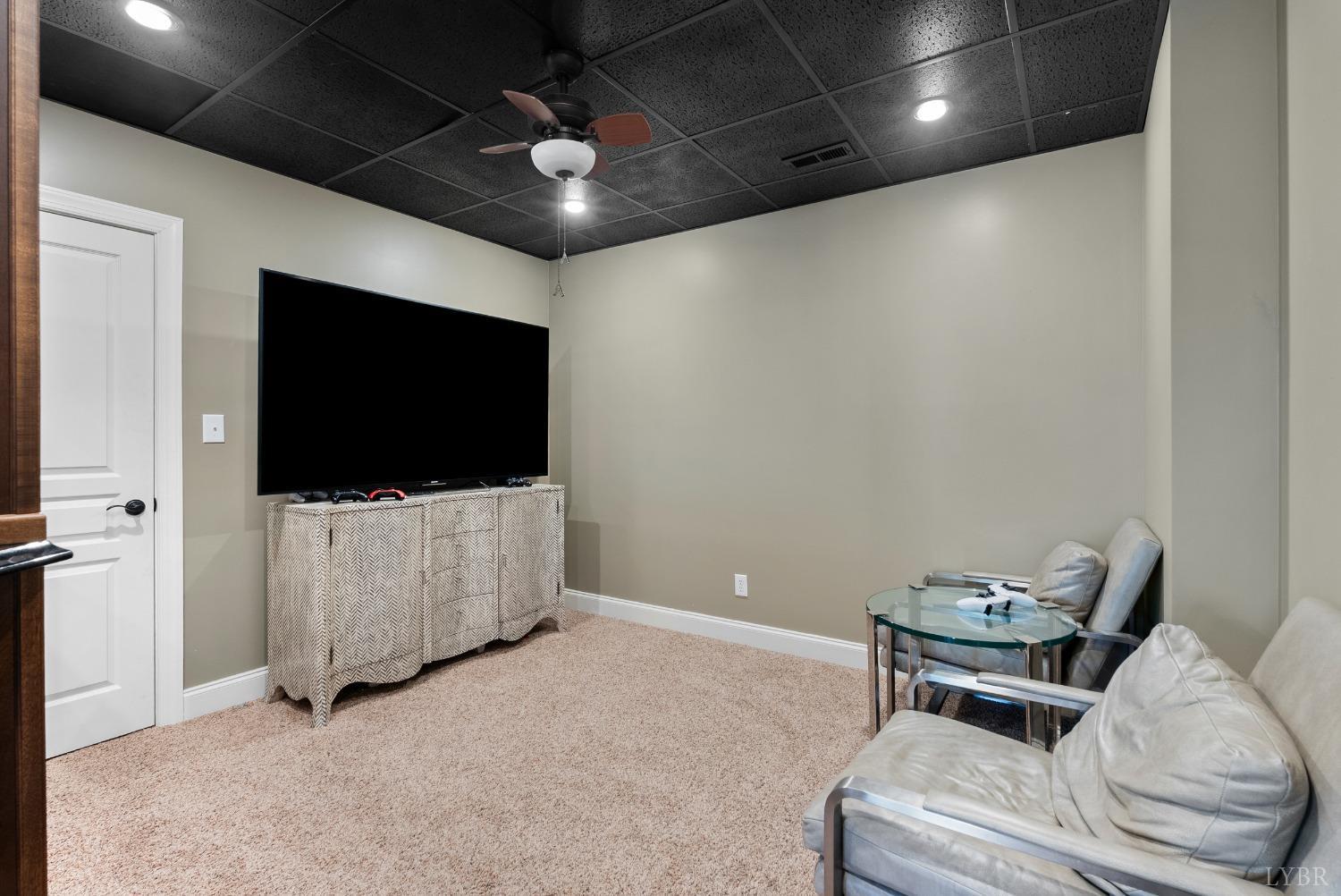 1249 Lees Mill Lane Goode, VA 24556 - Photo 56 of 98 a living room with furniture and a flat screen tv