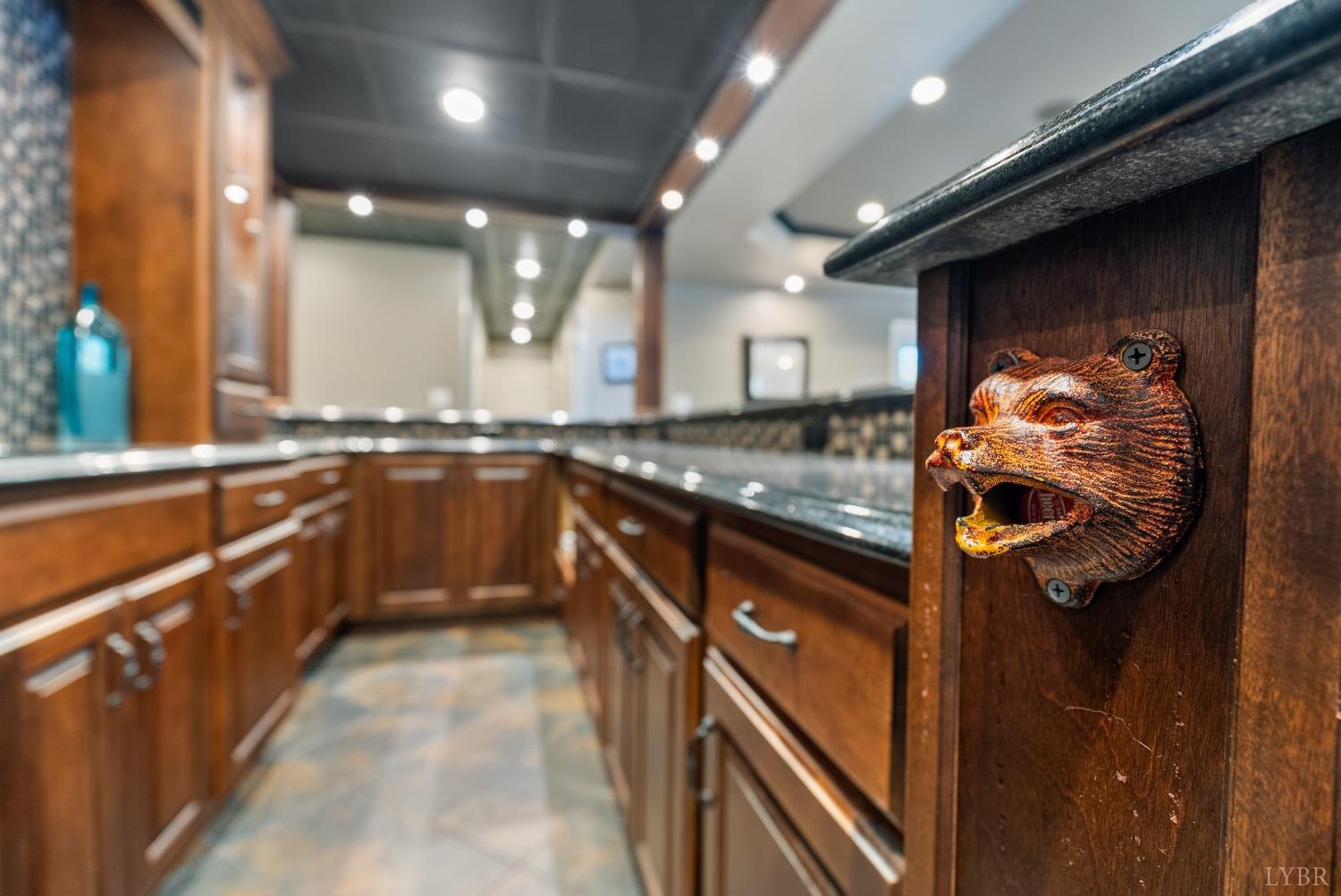 1249 Lees Mill Lane Goode, VA 24556 - Photo 60 of 98 a kitchen with stainless steel appliances granite countertop sink stove and cabinets