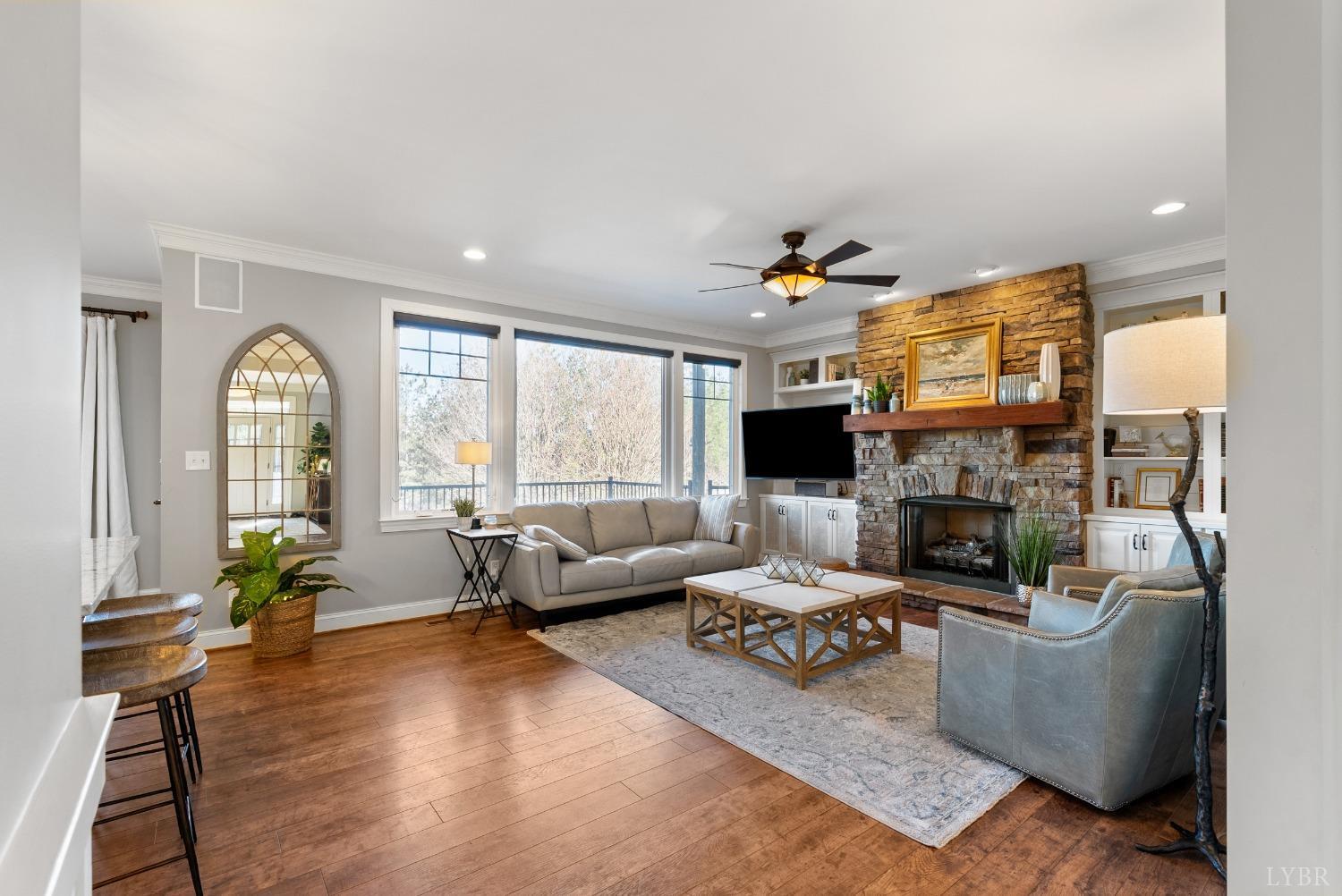 1249 Lees Mill Lane Goode, VA 24556 - Photo 10 of 98 a living room with fireplace furniture and a large window