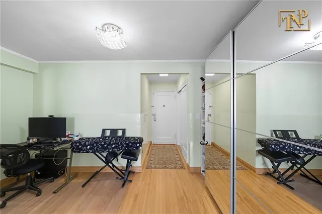 a view of a workspace with furniture and a gate