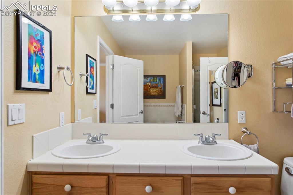 5655 Sonnet Ridge Point Colorado Springs, CO 80918 - Photo 20 of 47 Primary athroom with large vanity and double sink