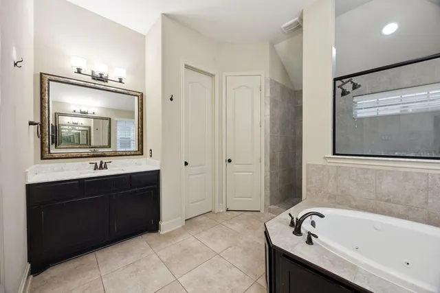 a bathroom with a bathtub and a sink