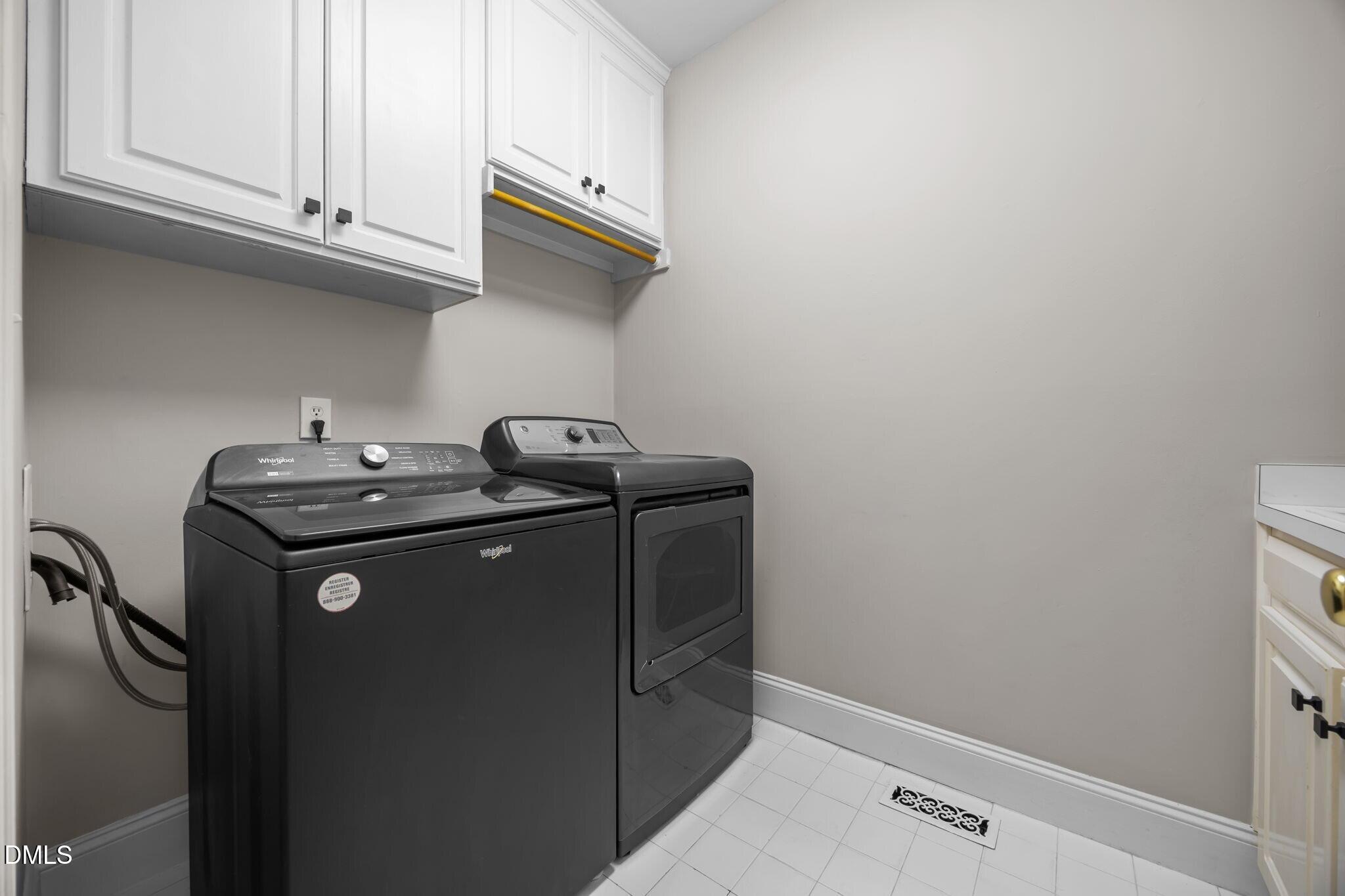 4741 Sharpstone Lane Raleigh, NC 27615 - Photo 48 of 59 a utility room with dryer and washer