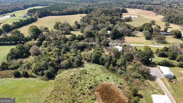 a view of a room with wooden floor and windows