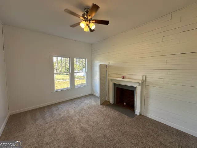 a spacious bathroom with a sink toilet and shower