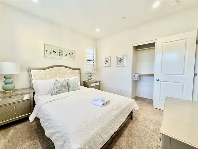 a bedroom with a bed and a cabinets