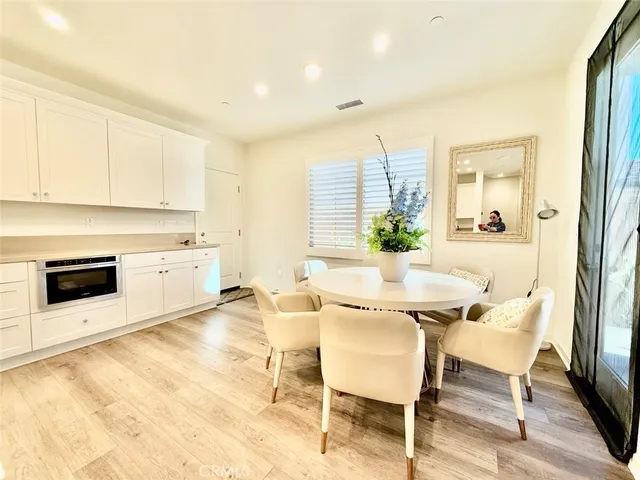 a view of a dining room with furniture and a fireplace