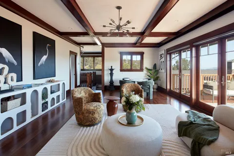 a living room with furniture fireplace and flat screen tv
