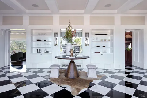 a view of a living room with a black white checkered floor