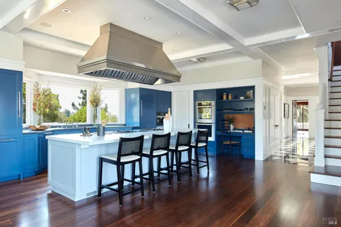 a kitchen with stainless steel appliances granite countertop a stove and a refrigerator