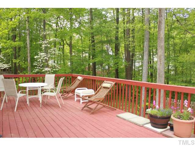 4504 Omni Place Raleigh, NC 27613 - Photo 22 of 25 Re-Painted Deck. Not just Large (30x12) ..has a wooded view with 0.36 acre lot and more..Nice usable yard and woods..best of both! Exterior Back