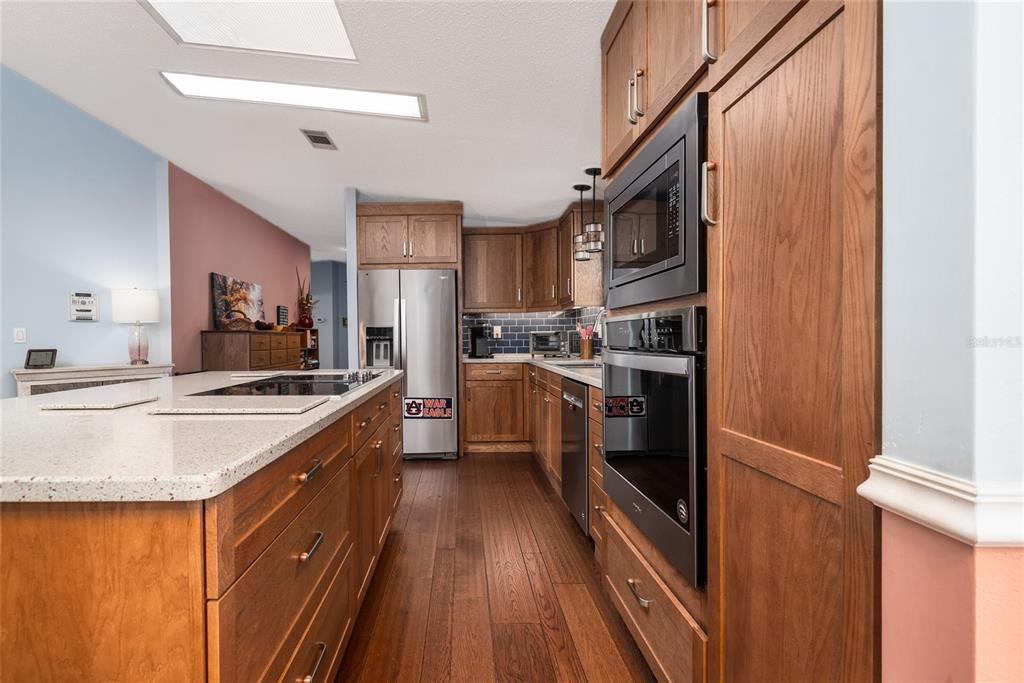 706 Starboard Avenue Edgewater, FL 32141 - Photo 11 of 35 a kitchen with stainless steel appliances granite countertop a stove and a refrigerator